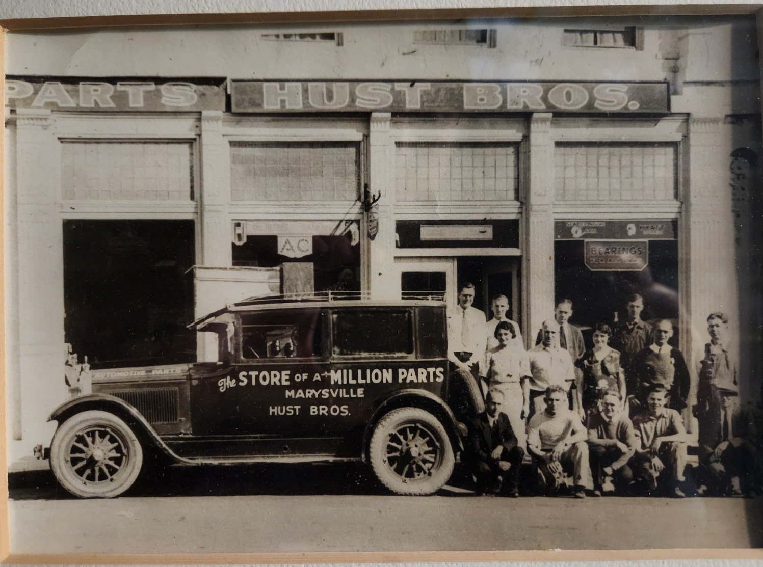 Historic Hust Brothers group photograph at the Masonic Hall entrance on 3rd Street in Marysville